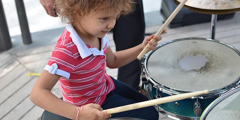 Child Playing Drums
